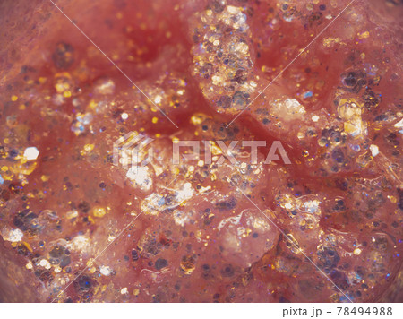 Pink glitter texture, small multi-colored decorative sequins for festive makeup or to be applied to nails. Beauty concept. Pink glitter texture, small multi-colored decorative sequins for festive makeup or to be applied to nails. Beauty concept. 78494988