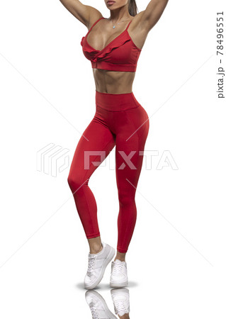 legs girl in red leggings and a top on a white background 78496551
