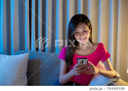 Woman Use Smart Phone Happily 78499596