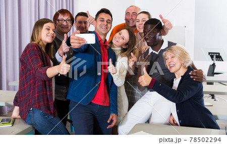 Adult students making selfie in class Adult students making selfie in class 78502294