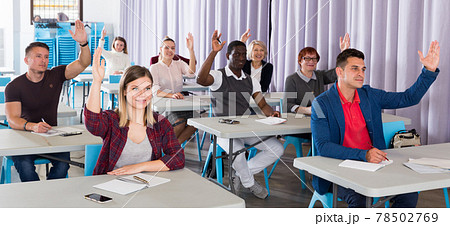 Student group with hands raised Student group with hands raised 78502769