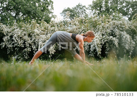 Young woman goes in for sports outdoors. Young woman goes in for sports outdoors. 78510133