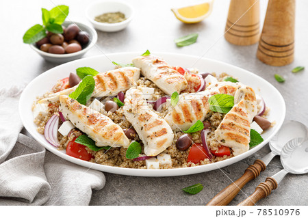 Grilled chicken breast and greek salad with quinoa 78510976