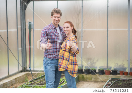 Optimistic young man and woman showing ok gesture Optimistic young man and woman showing ok gesture 78511081