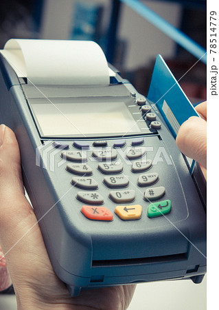 Payment terminal with credit card as device using for cashless paying for shopping in shop 78514779