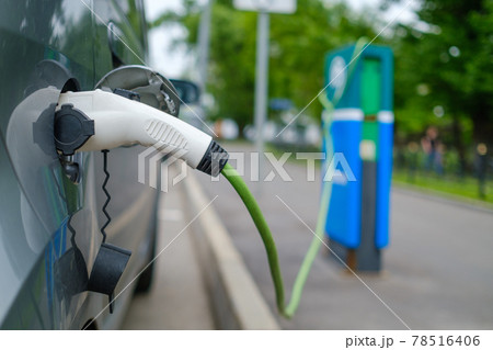 Electric car on charging station 78516406