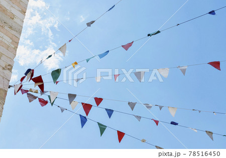 Strings of colored bunting flags 78516450