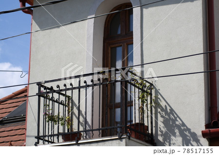 A building with a metal pole and the balcony A building with a metal pole and the balcony 78517155