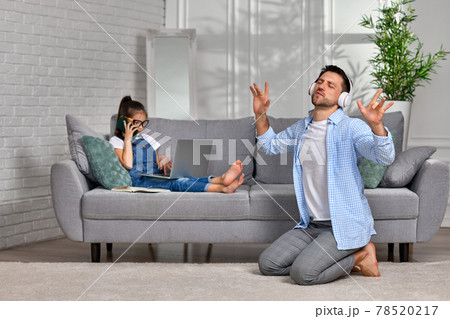 daughter learns using laptop and playful happy father dancing daughter learns using laptop and playful happy father dancing 78520217