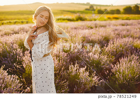 Woman in a white dress in a lavender field 78521249