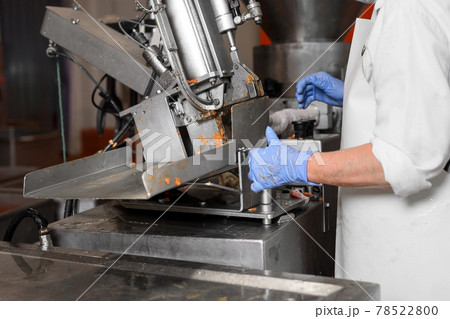 Sausages production at the meat processing factory. Sausages production at the meat processing factory. 78522800