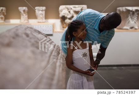 Man and his daughter visiting Art Museum Man and his daughter visiting Art Museum 78524397