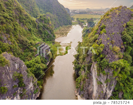 the majestic scenery on Ngo Dong river in Tam Coc Bich Dong view from drone in Ninh Binh province of Viet Nam the majestic scenery on Ngo Dong river in Tam Coc Bich Dong view from drone in Ninh Binh province of Viet Nam 78525724