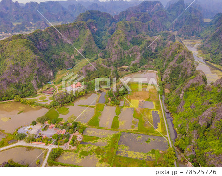 the majestic scenery on Ngo Dong river in Tam Coc Bich Dong view from drone in Ninh Binh province of Viet Nam the majestic scenery on Ngo Dong river in Tam Coc Bich Dong view from drone in Ninh Binh province of Viet Nam 78525726