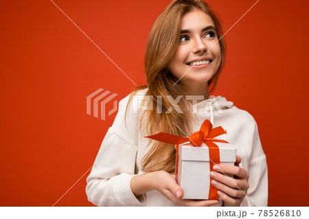 Shot of attractive positive smiling young blonde woman isolated over colourful background wall 78526810