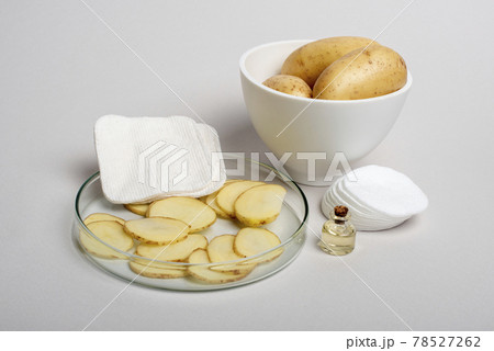 Sliced Potatoes prepared for cosmetic procedures. 78527262