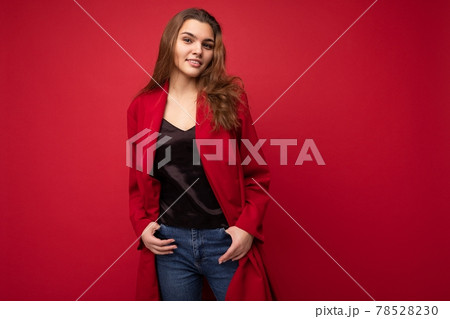 Portrait of positive cheerful fashionable woman in formalwear looking at camera isolated on red Portrait of positive cheerful fashionable woman in formalwear looking at camera isolated on red 78528230