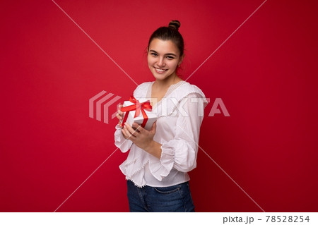 Shot of attractive positive smiling young brunette woman isolated over colourful background wall 78528254