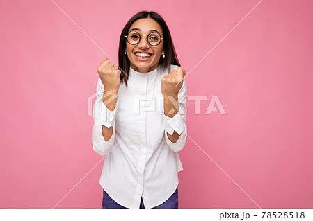 Photo of young positive happy smiling beautiful woman with sincere emotions wearing stylish clothes 78528518