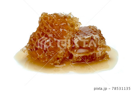Fresh Honeycomb slice and honey isolated on white background Fresh Honeycomb slice and honey isolated on white background 78531135