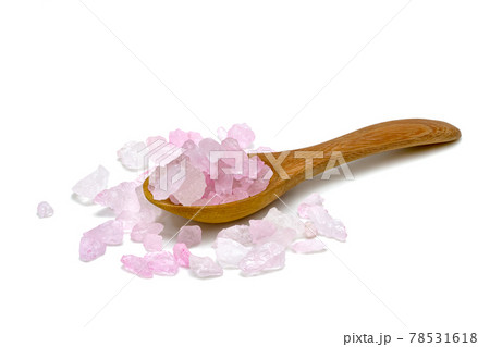 Rock Sugar or crystalline sugar with wooden spoon isolated on white background 78531618