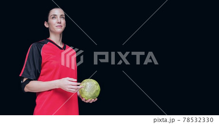 Composition of caucasian female handball player holding ball with copy space on black background 78532330