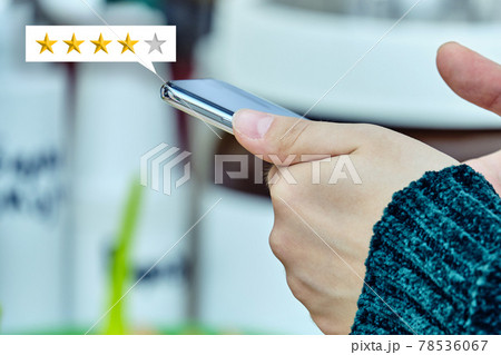 Star rating concept. The person uses a smartphone and gives feedback. Star rating concept. The person uses a smartphone and gives feedback. 78536067