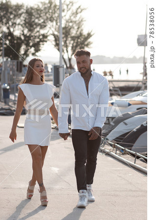 Couple standing in port in summer 78538056