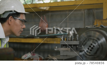 professional mechanical engineer or operation man wear uniform goggles safety working on workshop metal lathe industrial professional mechanical engineer or operation man wear uniform goggles safety working on workshop metal lathe industrial 78540856
