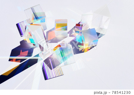 Abstract background with glass geometric figures prisms with light diffraction of spectrum colors and complex reflection. Real photo 78541230