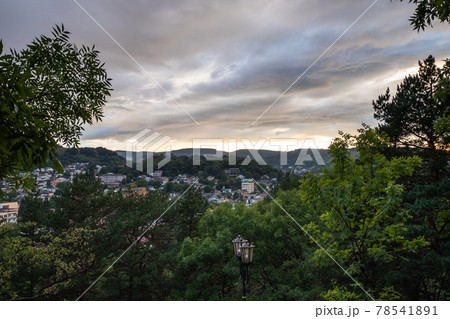 Kislovodsk town in evening twilight under cloudy sky 78541891