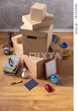 Cardboard boxes and things for moving to new home. Stack of cardboard box on floor background. 78544490