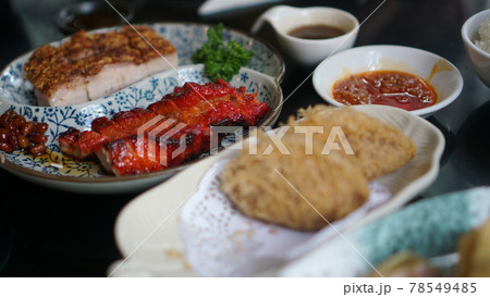 Cantonese dimsum breakfast style bbq honey pork, crispy skin pork and deep fried taro dumpling set food Cantonese dimsum breakfast style bbq honey pork, crispy skin pork and deep fried taro dumpling set food 78549485