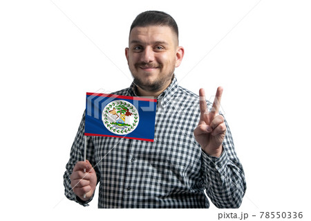 White guy holding a flag of Belize and shows two fingers isolated on a white background White guy holding a flag of Belize and shows two fingers isolated on a white background 78550336