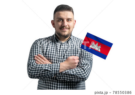 White guy holding a flag of Cambodia smiling confident with crossed arms isolated on a white background White guy holding a flag of Cambodia smiling confident with crossed arms isolated on a white background 78550386