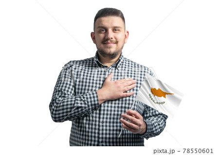 White guy holding a flag of Cyprus and holds his hand on his heart isolated on a white background With love to Cyprus 78550601