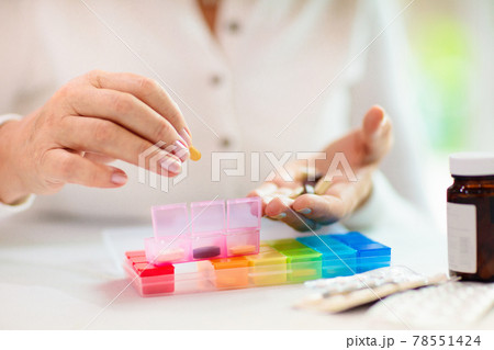 Pill box for senior patient. Medicine container. 78551424