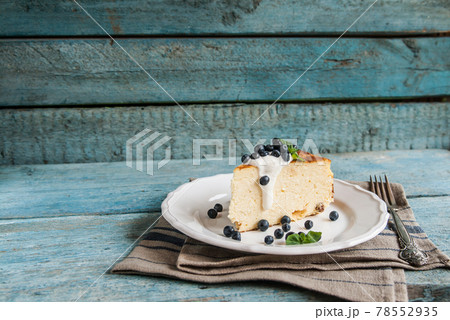 Cottage cheese baked pudding, sour cream and blueberries 78552935