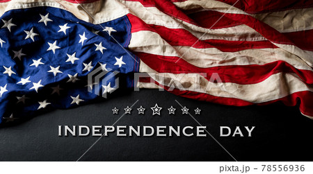 Happy Independence day: 4th of July, American flag on black wooden background with the text. 78556936
