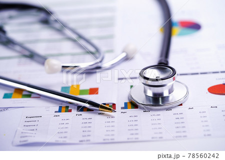 Stethoscope, Charts and Graphs spreadsheet paper, Finance, Account, Statistics, Investment, Analytic research data economy spreadsheet and Business company concept.. 78560242