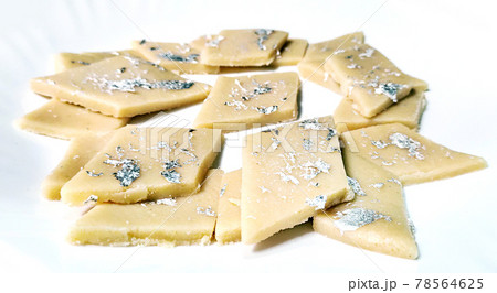 Kaju Katli is a Diamond shape Indian sweet made using cashew sugar and mava, served in a plate isolated on white background. selective focus Kaju Katli is a Diamond shape Indian sweet made using cashew sugar and mava, served in a plate isolated on white background. selective focus 78564625
