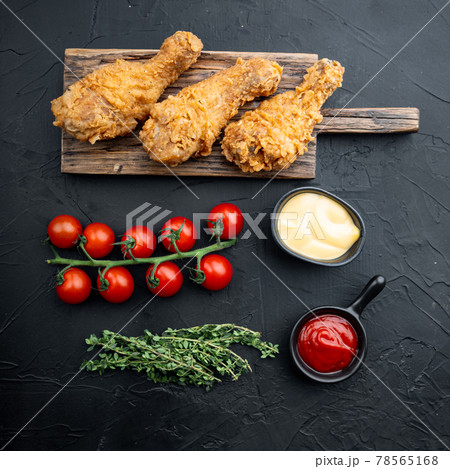 Crispy fried chicken on black background, top view 78565168