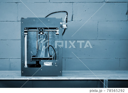 3D printer working close up. Automatic three dimensional 3d printer 78565292