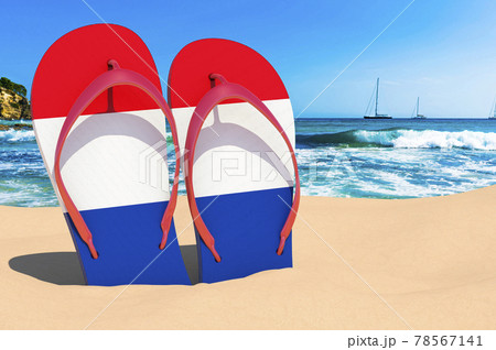 Flip flops with The Netherlands flag on the beach. the Netherlands resorts, vacation, tours, travel packages concept. 3D rendering 78567141