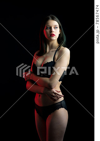 Vertical photo of beautiful shy lady in lace bikini boudoir bra panties. 78567474