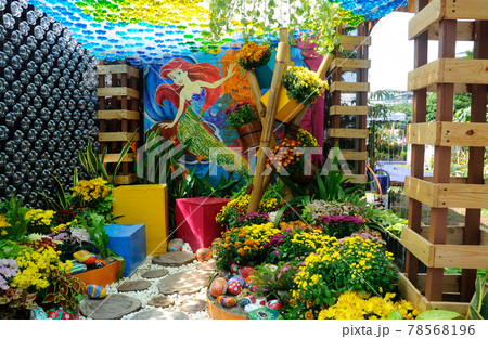 PUTRAJAYA, MALAYSIA -MAY 30, 2016: Small pocket garden made from mix of recycle material and mix of flower at Floria Garden, Putrajaya, Malaysia. PUTRAJAYA, MALAYSIA -MAY 30, 2016: Small pocket garden made from mix of recycle material and mix of flower at Floria Garden, Putrajaya, Malaysia. 78568196