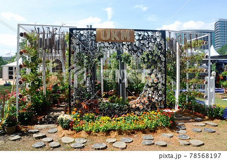 PUTRAJAYA, MALAYSIA -MAY 30, 2016: Small pocket garden made from mix of recycle material and mix of flower at Floria Garden, Putrajaya, Malaysia. PUTRAJAYA, MALAYSIA -MAY 30, 2016: Small pocket garden made from mix of recycle material and mix of flower at Floria Garden, Putrajaya, Malaysia. 78568197