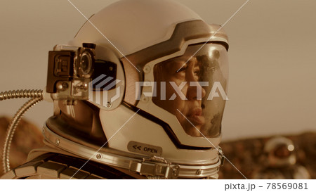 Female cosmonaut recording video during expedition on Mars Female cosmonaut recording video during expedition on Mars 78569081