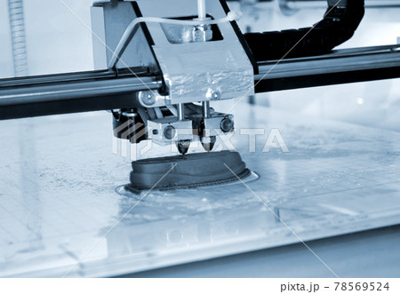 3D printer prints the form of molten plastic blue close-up. 3D printer prints the form of molten plastic blue close-up. 78569524