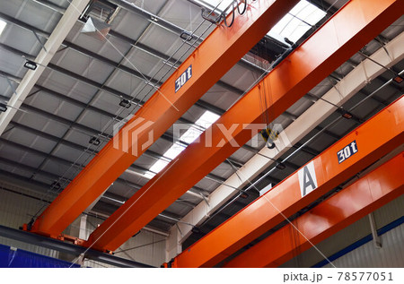 Bridge lifting Crane Hook with electric engine on background of industrial workshop production plant Bridge lifting Crane Hook with electric engine on background of industrial workshop production plant 78577051